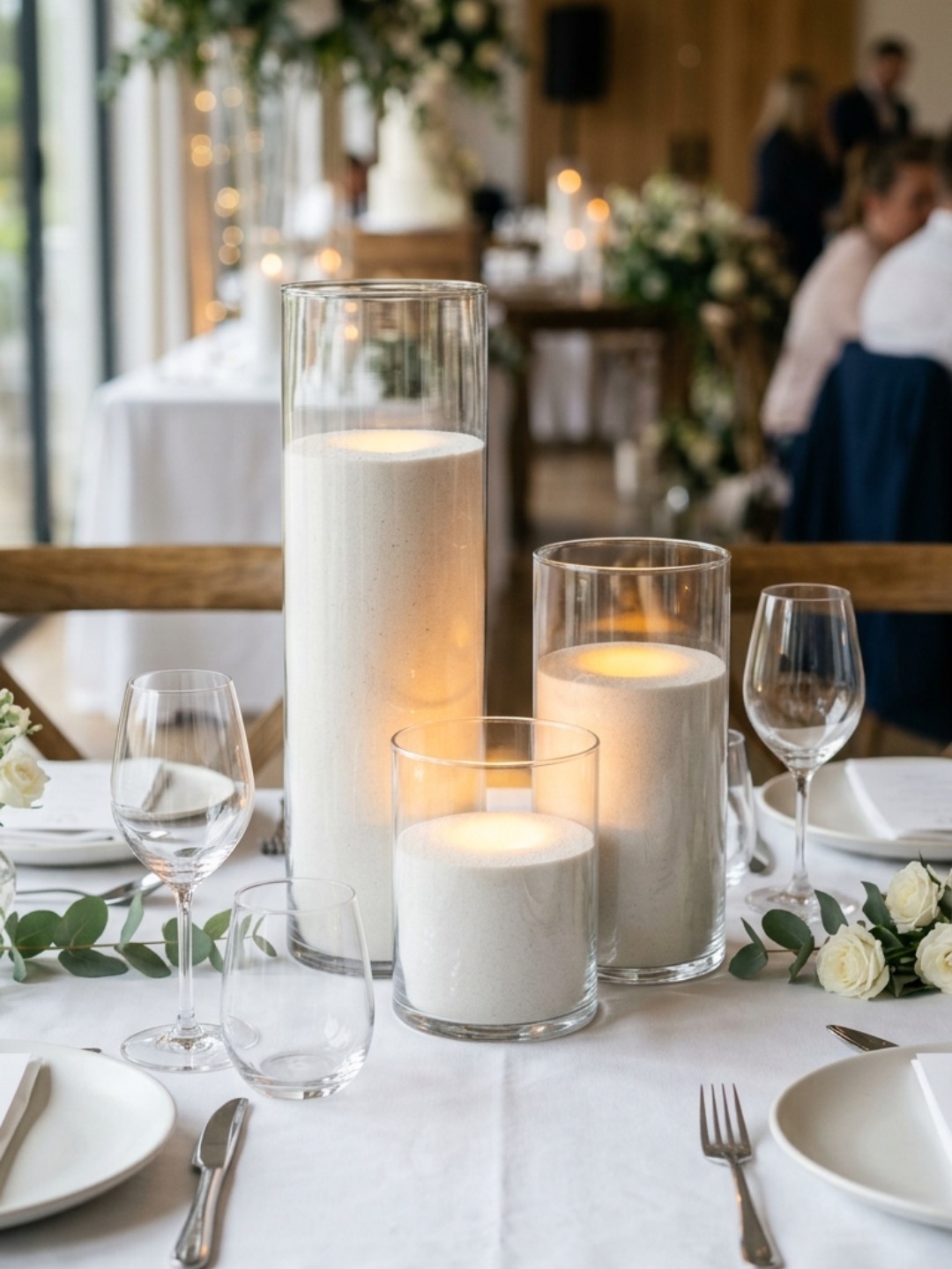 Candlelit wedding decor with layered glass vessels