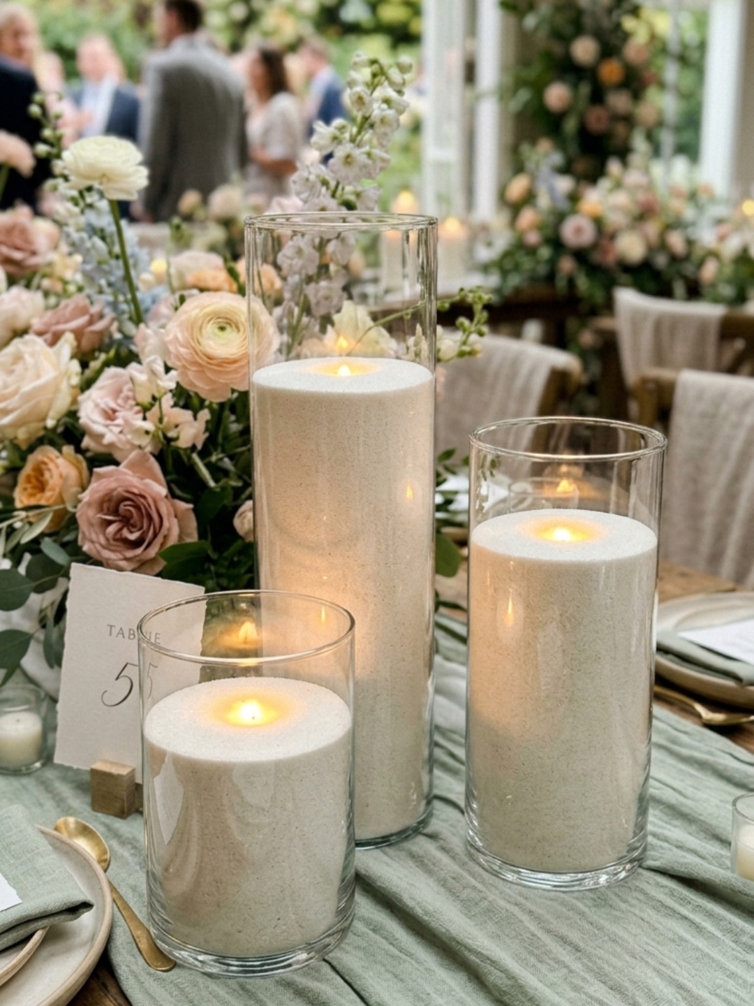 Candlelit wedding table styling with mixed vessel heights