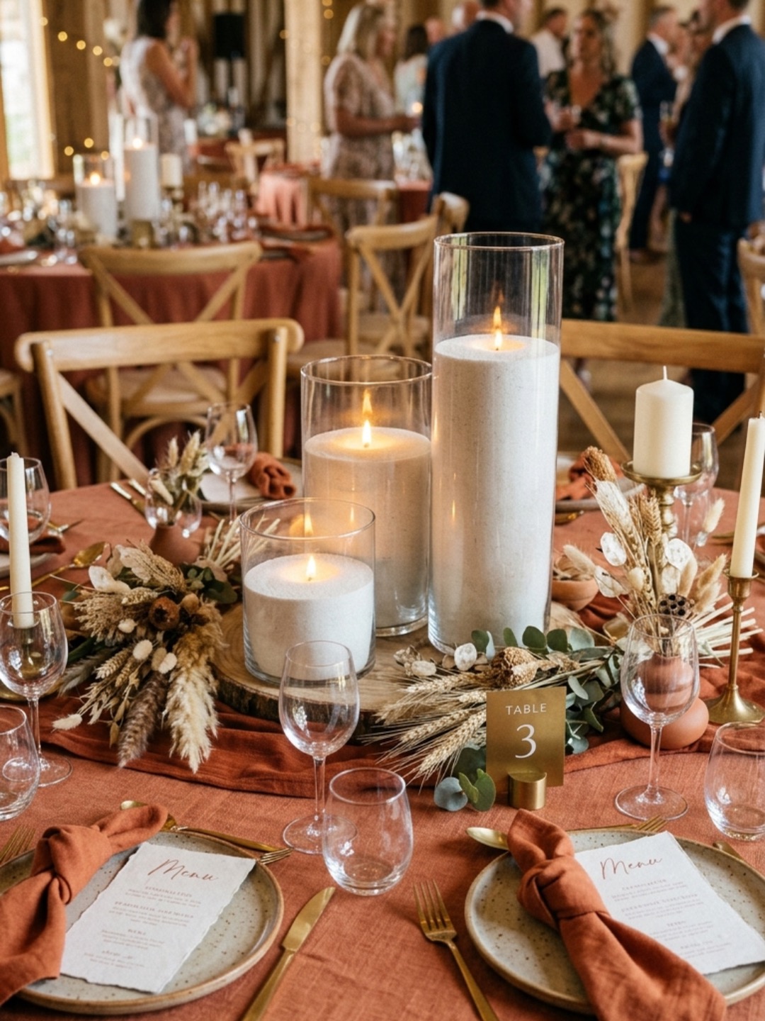 Ready-to-light wedding candles arranged in glass vessels for pickup